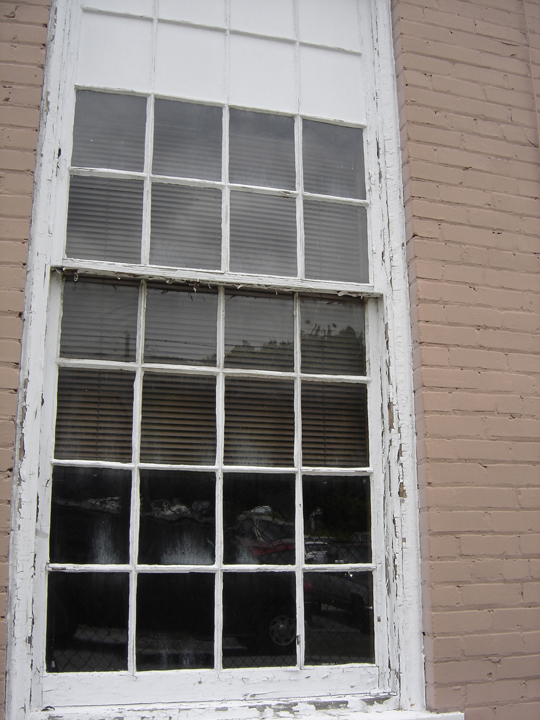 Old worn window before replacement by Walters Construction